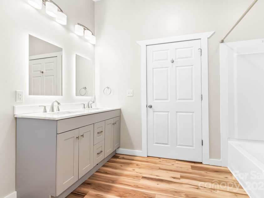 217 Royal Pines Drive, Arden, NC 28704.  MLS# CAR4257398, YatesRealty ID 13374. Updated primary bath. Door opens to primary bedroom