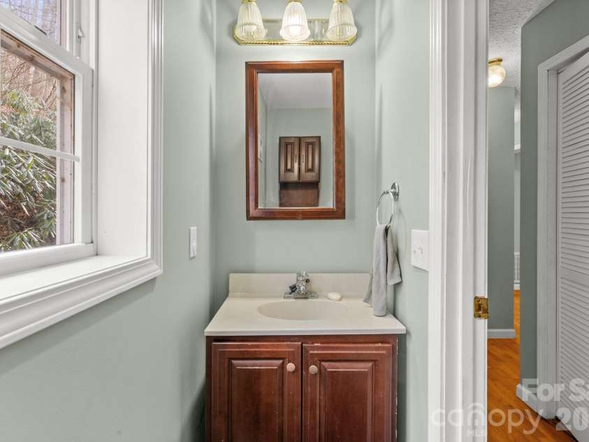 842 Grouse Road, Clyde, NC 28721.  MLS# CAR4326443, YatesRealty ID 13378. Half Bath