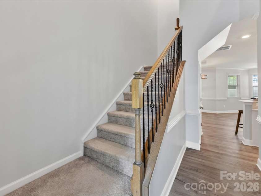 5218 Spanish Ivy Lane, Indian Land, SC 29707.  MLS# CAR4359918, YatesRealty ID 13379. Iron Balusters on Staircase