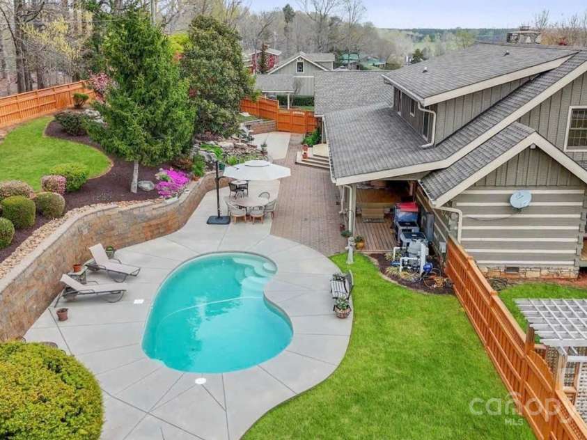 1620 London Road, Mooresville, NC 28115.  MLS# CAR4281112, YatesRealty ID 13387. Look at all this privacy. Beautifully landscaped, private and fenced. The pool is a salt water in ground pool.