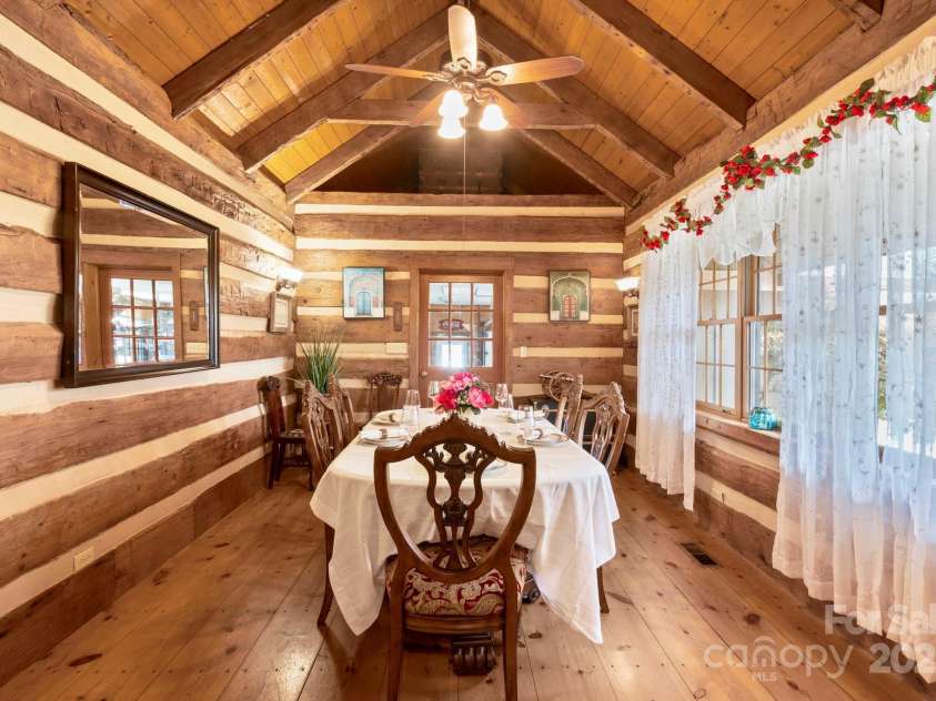 1620 London Road, Mooresville, NC 28115.  MLS# CAR4281112, YatesRealty ID 13387. The Dining Room in the Main Residence is built from logs dating back to 1820 from West Virgina.