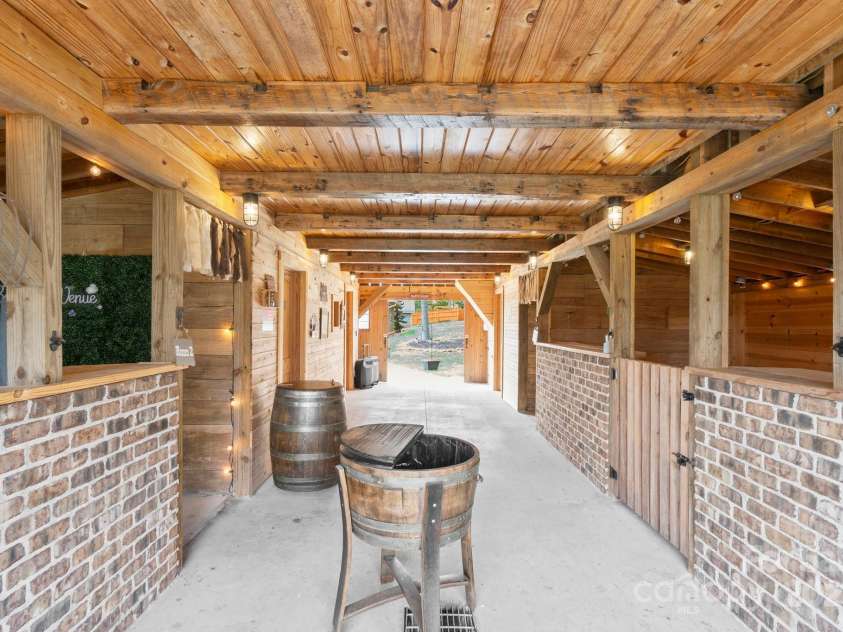 1620 London Road, Mooresville, NC 28115.  MLS# CAR4281112, YatesRealty ID 13387. The interior of the party Barn