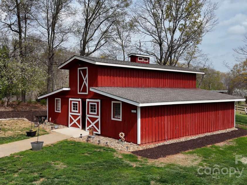 1620 London Road, Mooresville, NC 28115.  MLS# CAR4281112, YatesRealty ID 13387. The Party Barn was renovated from a working barn to a party barn and has all the bells and whistles including party rooms, a kitchen, bathroom facilities,and the upper floor has been floored and ready for future expansi