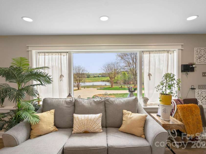 1620 London Road, Mooresville, NC 28115.  MLS# CAR4281112, YatesRealty ID 13387. This is the view of the pond from the living room of the Guest House.