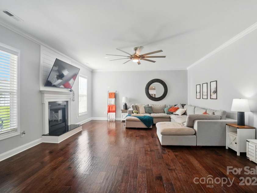 6314 Bluffton Lane, Midland, NC 28107.  MLS# CAR4256231, YatesRealty ID 13390. Large Great Room with a gas fireplace and views of the kitchen and the backyard