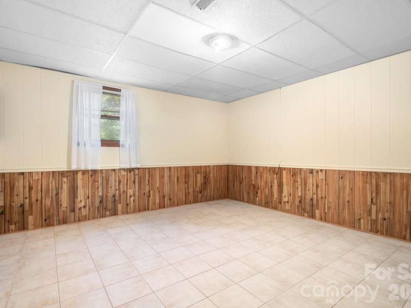 5343 Cannon Drive, Granite Falls, NC 28630.  MLS# CAR4366225, YatesRealty ID 13393. Basement bedroom