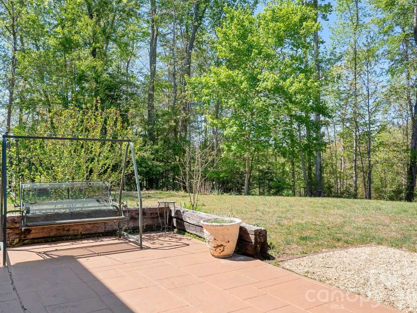 5343 Cannon Drive, Granite Falls, NC 28630.  MLS# CAR4366225, YatesRealty ID 13393. Tree lined backyard