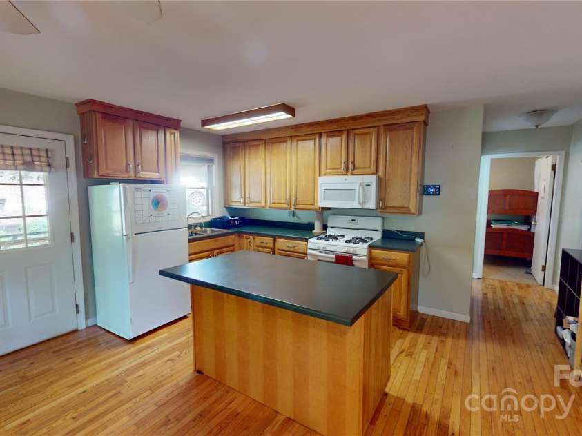 78 Smiling Fox Trail, Brevard, NC 28712.  MLS# CAR4176816, YatesRealty ID 134. Main house kitchen
