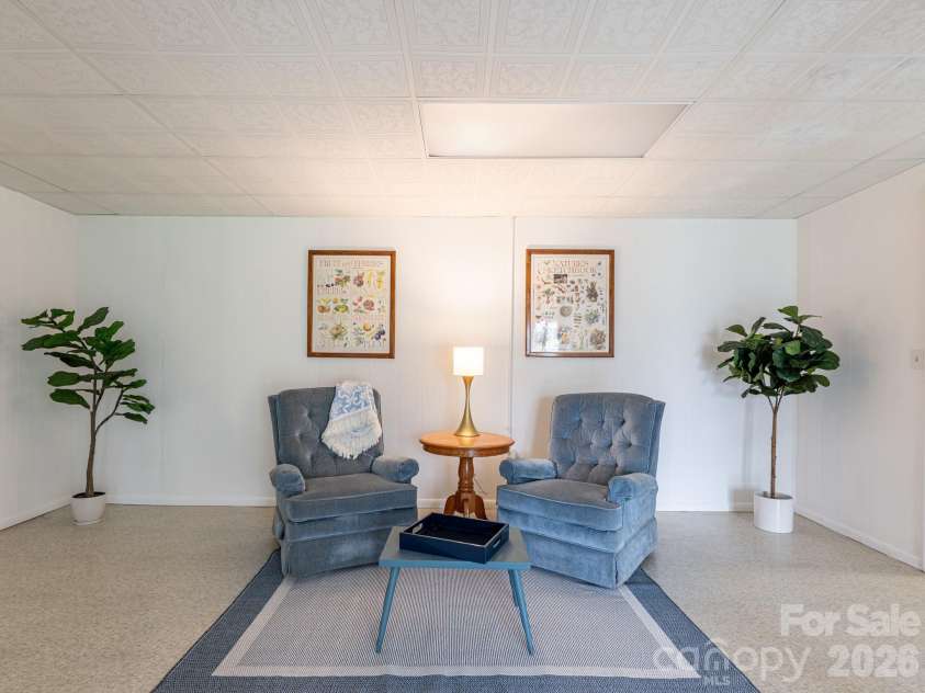 56 Skyview Terrace, Asheville, NC 28806.  MLS# CAR4360623, YatesRealty ID 13416. Den in basement level.