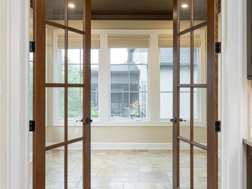 87 Chantilly Drive, Asheville, NC 28804.  MLS# CAR4306861, YatesRealty ID 13417. Interior glass French doors welcome you