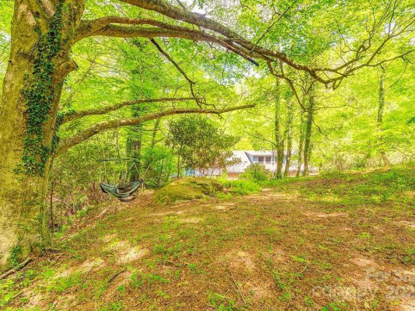 2102 Walnut CreeK Road, Marshall, NC 28753.  MLS# CAR4235544, YatesRealty ID 13420. Look at the Big Rock!
