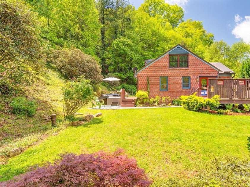 2102 Walnut CreeK Road, Marshall, NC 28753.  MLS# CAR4235544, YatesRealty ID 13420. Side Yard - BlueBerry Bushes, Roses & MORE