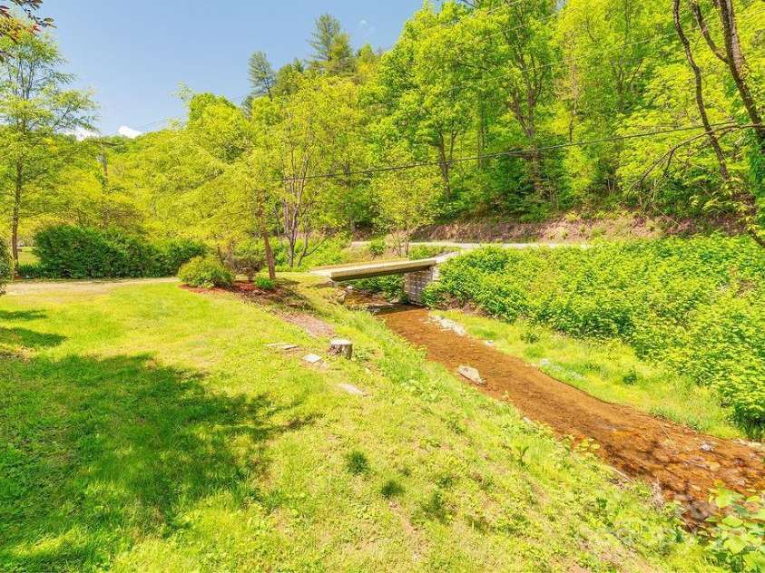 2102 Walnut CreeK Road, Marshall, NC 28753.  MLS# CAR4235544, YatesRealty ID 13420. You can Hear this Creek throughout the Property