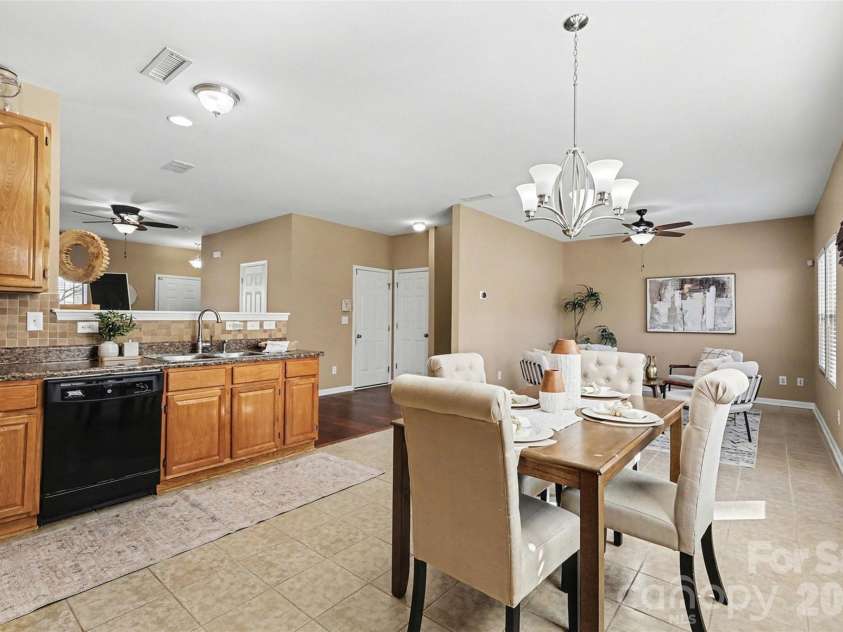 1806 Tradd Avenue, Clover, SC 29710.  MLS# CAR4362230, YatesRealty ID 13421. Large kitchen with tall cabinets and spacious dining area