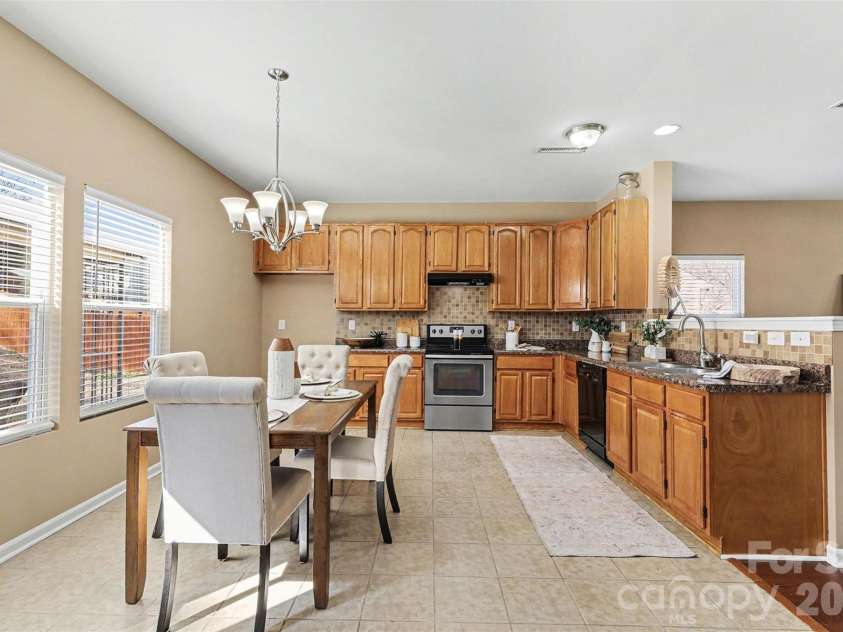 1806 Tradd Avenue, Clover, SC 29710.  MLS# CAR4362230, YatesRealty ID 13421. Large kitchen with tall cabinets and spacious dining area