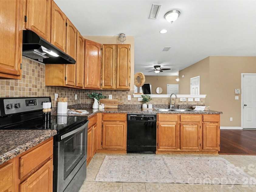 1806 Tradd Avenue, Clover, SC 29710.  MLS# CAR4362230, YatesRealty ID 13421. Large kitchen with tall cabinets and spacious dining area