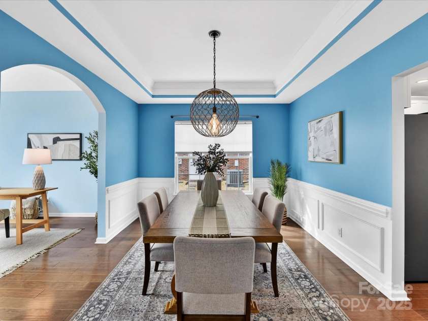 15815 Lavenham Road, Huntersville, NC 28078.  MLS# CAR4328417, YatesRealty ID 13422. Formal Dining Room features tray ceiling, custom light fixture, wainscoting & crown molding!