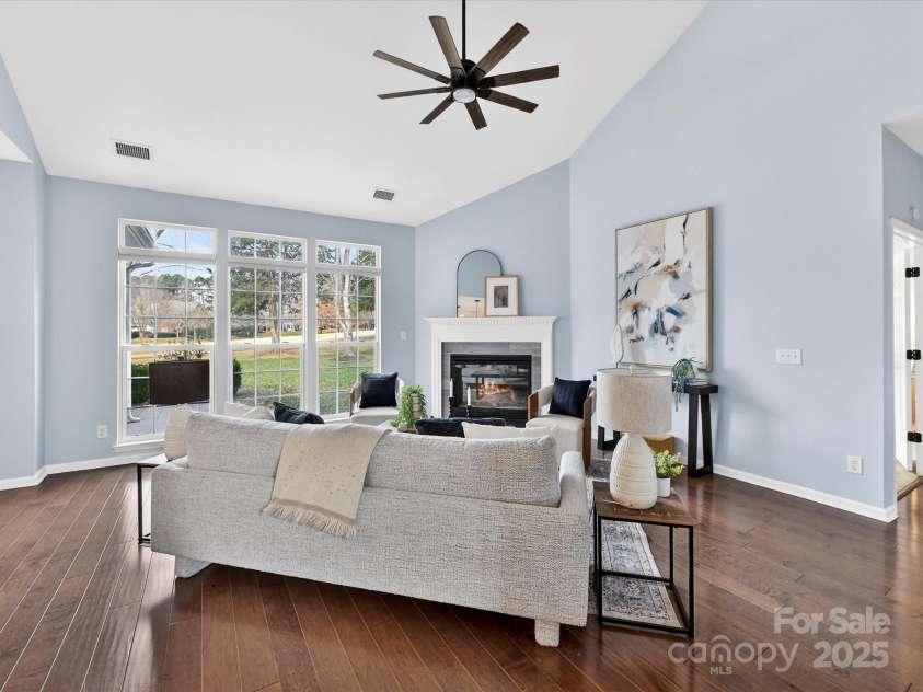 15815 Lavenham Road, Huntersville, NC 28078.  MLS# CAR4328417, YatesRealty ID 13422. Vaulted Great Room offers gas fireplace, custom ceiling fan/light & fabulous natural light flowing in!
