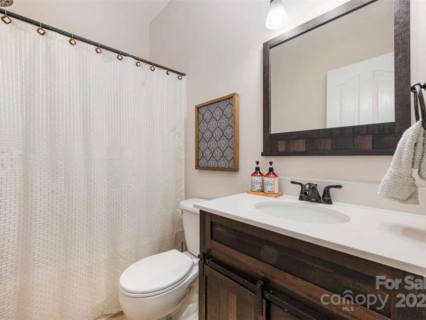 4741 Nijinsky Court, Charlotte, NC 28216.  MLS# CAR4186000, YatesRealty ID 13422. Downstairs bathroom