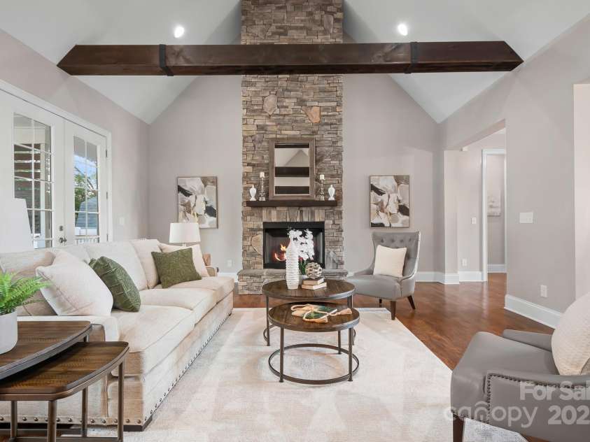 121 Dabbling Duck Circle, Mooresville, NC 28117.  MLS# CAR4232338, YatesRealty ID 13427. Grand 2-story stone fireplace and wood beams in great room