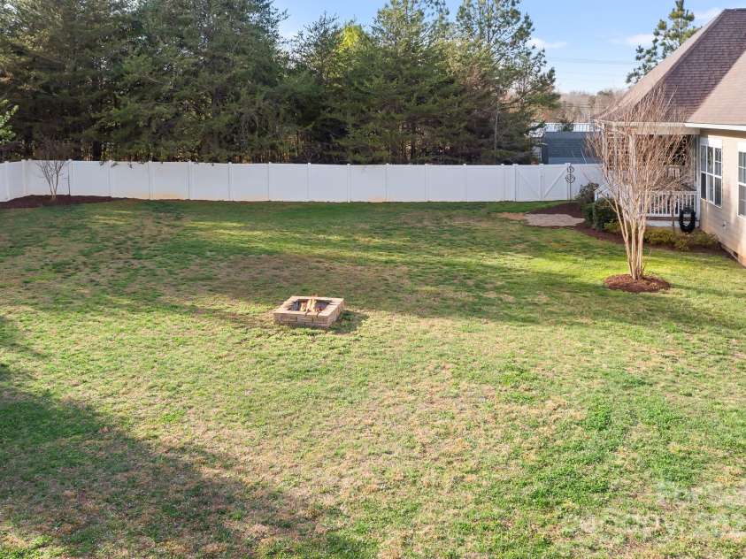 121 Dabbling Duck Circle, Mooresville, NC 28117.  MLS# CAR4232338, YatesRealty ID 13427. Huge rear yard w/ privacy fence and firepit