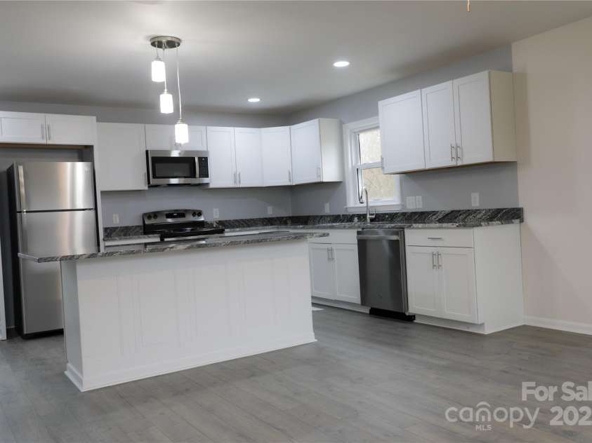 31655 Pinewood Drive, New London, NC 28127.  MLS# CAR4205536, YatesRealty ID 1343. Kitchen/Open Livingroom area