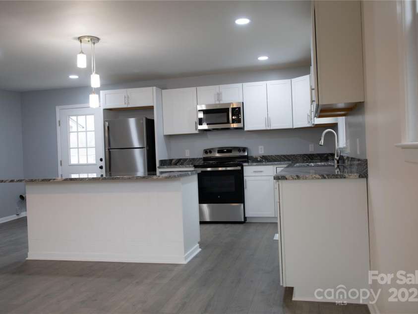 31655 Pinewood Drive, New London, NC 28127.  MLS# CAR4205536, YatesRealty ID 1343. Kitchen/Open Livingroom area