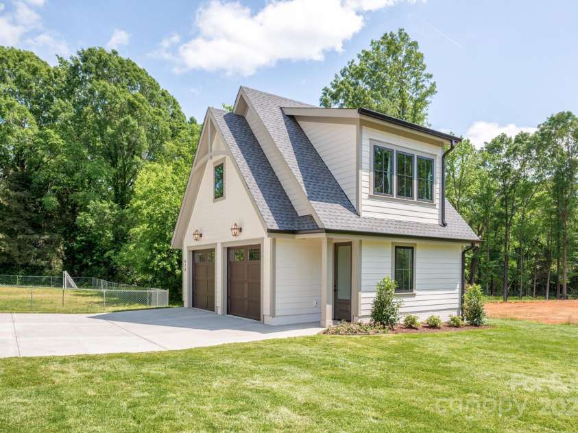626 Concord Road, Davidson, NC 28036.  MLS# CAR4160733, YatesRealty ID 13431. Garage has walk up storage and can be finished as an apartment.