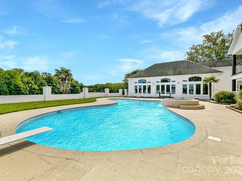 3245 Jackson Road, Mooresville, NC 28115.  MLS# CAR4161494, YatesRealty ID 13432. Gorgeous Pool/Spa with plenty of pool decking for lounging!