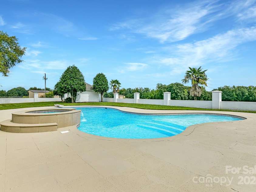 3245 Jackson Road, Mooresville, NC 28115.  MLS# CAR4161494, YatesRealty ID 13432. Gorgeous Pool/Spa with plenty of pool decking for lounging!
