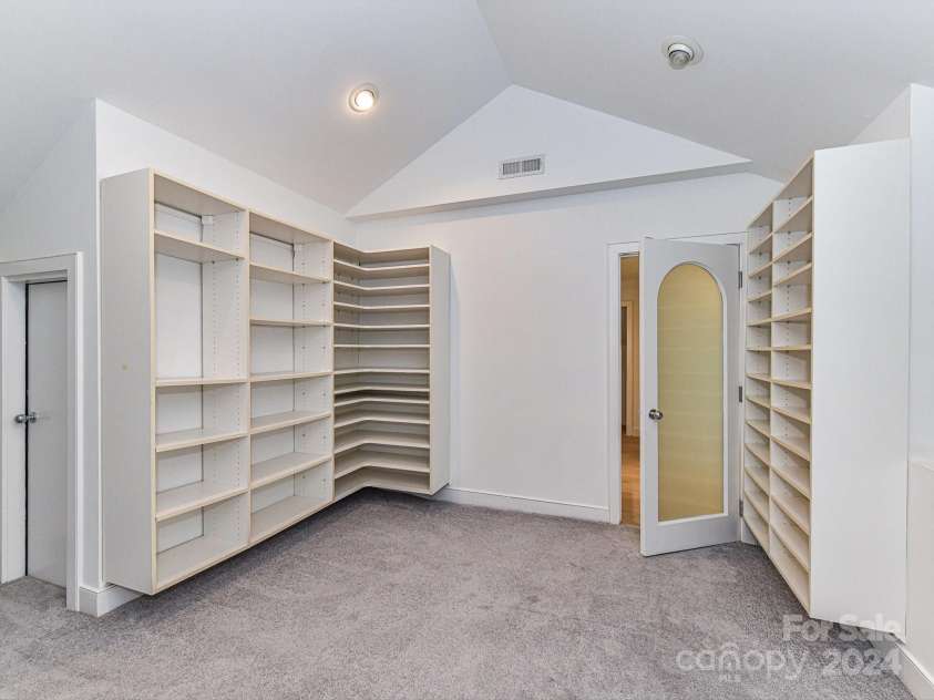 3245 Jackson Road, Mooresville, NC 28115.  MLS# CAR4161494, YatesRealty ID 13432. Huge Primary Walk In Closet with built in cabinets/shelving!