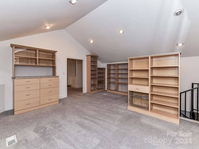 3245 Jackson Road, Mooresville, NC 28115.  MLS# CAR4161494, YatesRealty ID 13432. Huge Primary Walk In Closet with cabinets/shelving to remain!