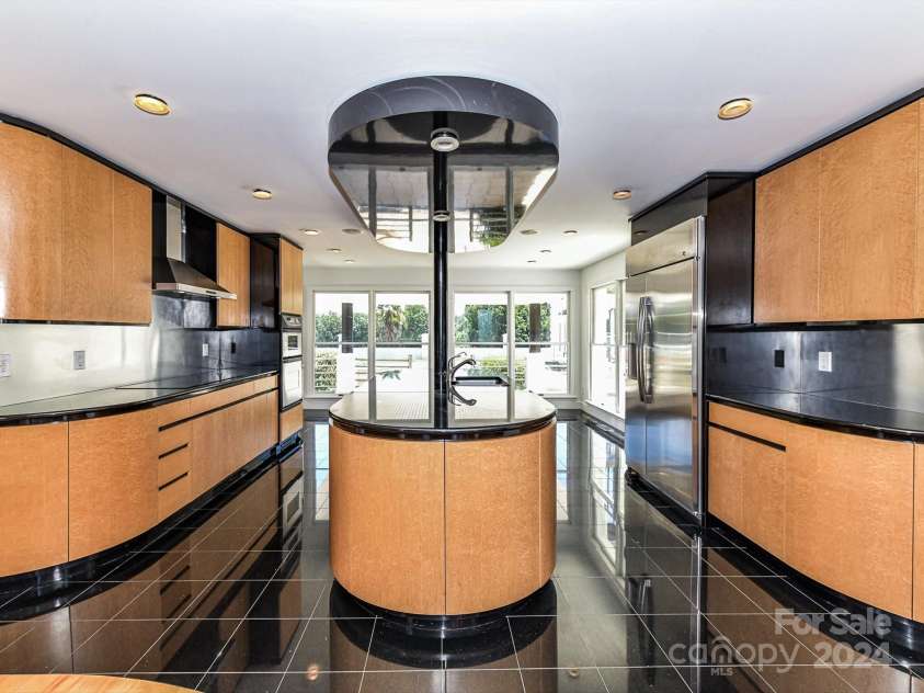 3245 Jackson Road, Mooresville, NC 28115.  MLS# CAR4161494, YatesRealty ID 13432. Large Kitchen offers stainless steel appliances including double oven, hood systen, center island, & plenty of modern cabinetry for storage!
