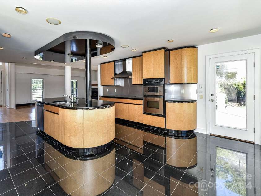 3245 Jackson Road, Mooresville, NC 28115.  MLS# CAR4161494, YatesRealty ID 13432. Large Kitchen offers stainless steel appliances including double oven, hood systen, center island, & plenty of modern cabinetry for storage!