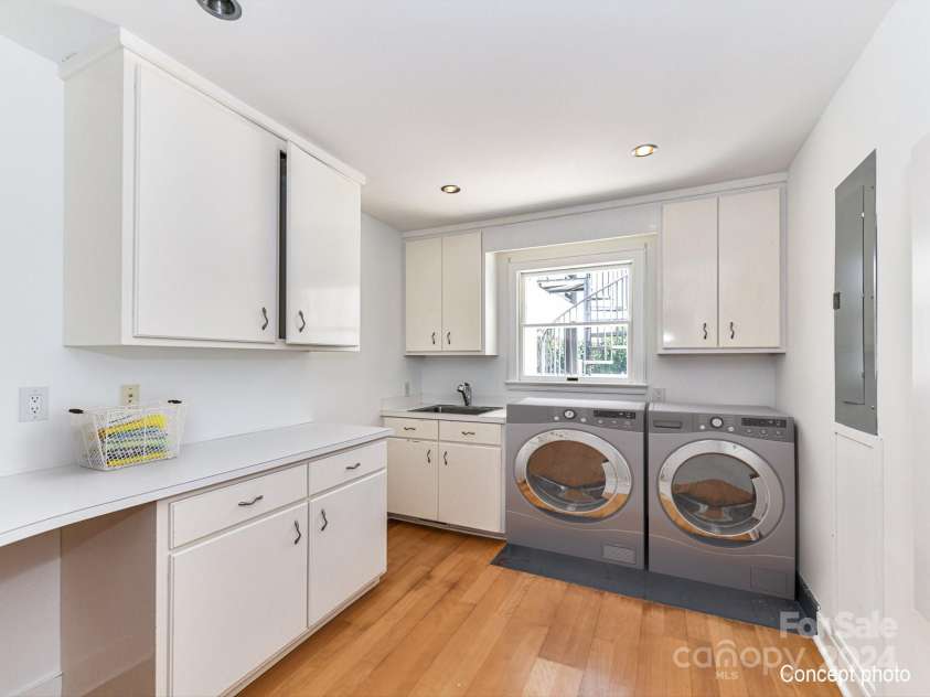 3245 Jackson Road, Mooresville, NC 28115.  MLS# CAR4161494, YatesRealty ID 13432. Laundry Room on main level features cabinets for storage & sink!