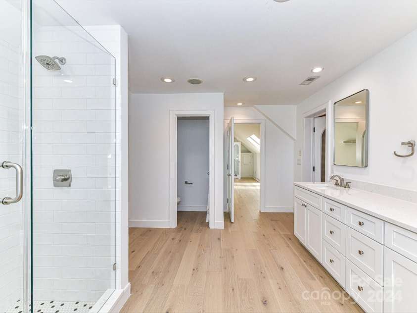 3245 Jackson Road, Mooresville, NC 28115.  MLS# CAR4161494, YatesRealty ID 13432. Remodeled Primary Bath with dual, quartz counters & walk in tiled shower!