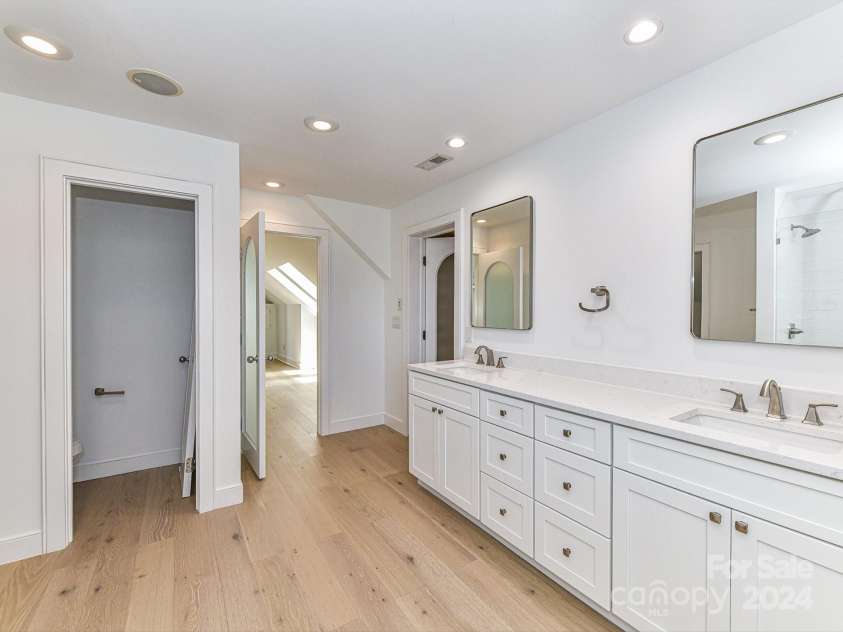 3245 Jackson Road, Mooresville, NC 28115.  MLS# CAR4161494, YatesRealty ID 13432. Remodeled Primary Bath with dual, quartz counters & walk in tiled shower!