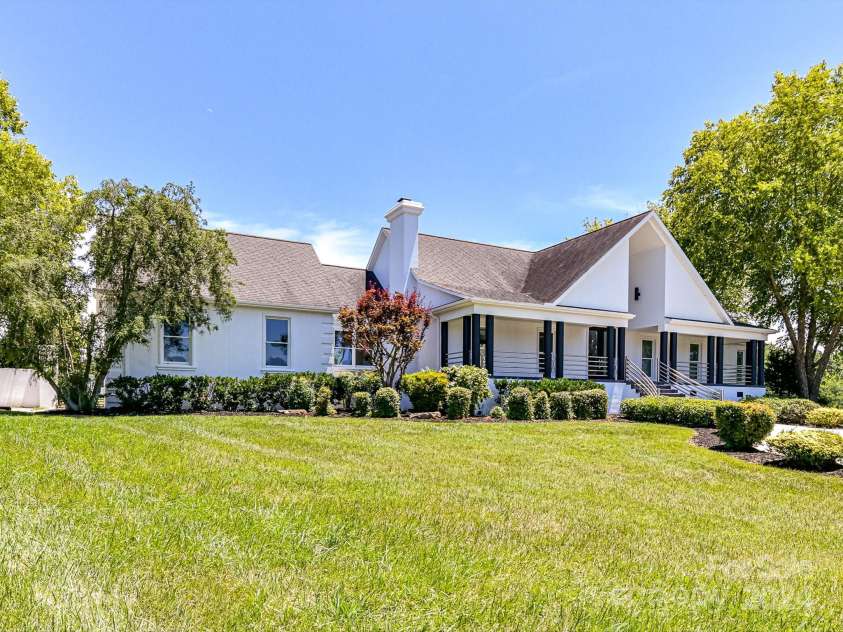 3245 Jackson Road, Mooresville, NC 28115.  MLS# CAR4161494, YatesRealty ID 13432. Spectacular, Custom, Modern, 2 Story Home with 2 Car Side Load Garage, Expansive Pool/Spa, located on 14 sprawling acres of level pasture land & surrounded by Equestrian properties!