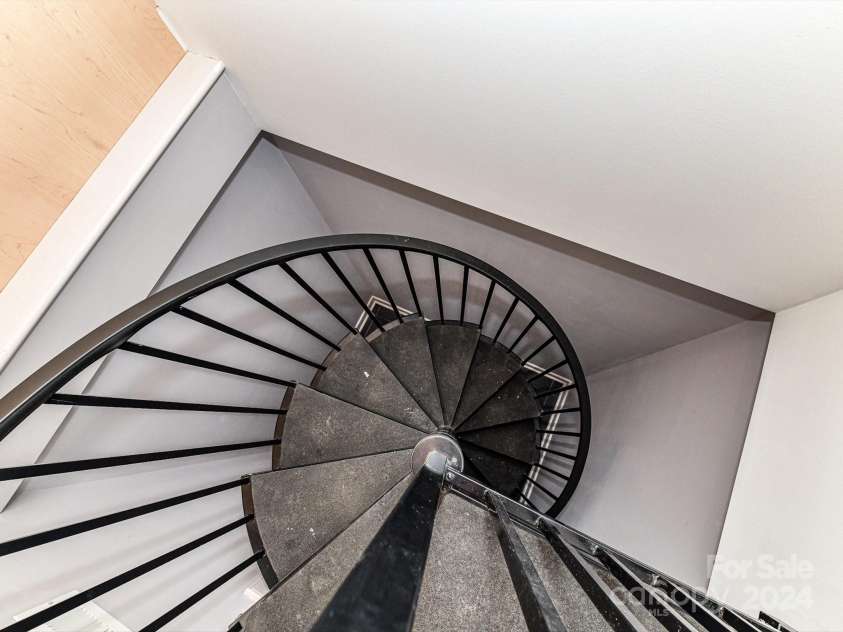 3245 Jackson Road, Mooresville, NC 28115.  MLS# CAR4161494, YatesRealty ID 13432. Spiral Staircase in Primary Closet to main level!