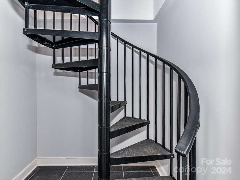 3245 Jackson Road, Mooresville, NC 28115.  MLS# CAR4161494, YatesRealty ID 13432. Spiral Staircase to main level from Primary Closet!