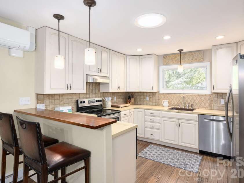 24 Woodcrest Road, Asheville, NC 28804.  MLS# CAR4370918, YatesRealty ID 13434. Kitchen Includes Cherry Breakfast Bar