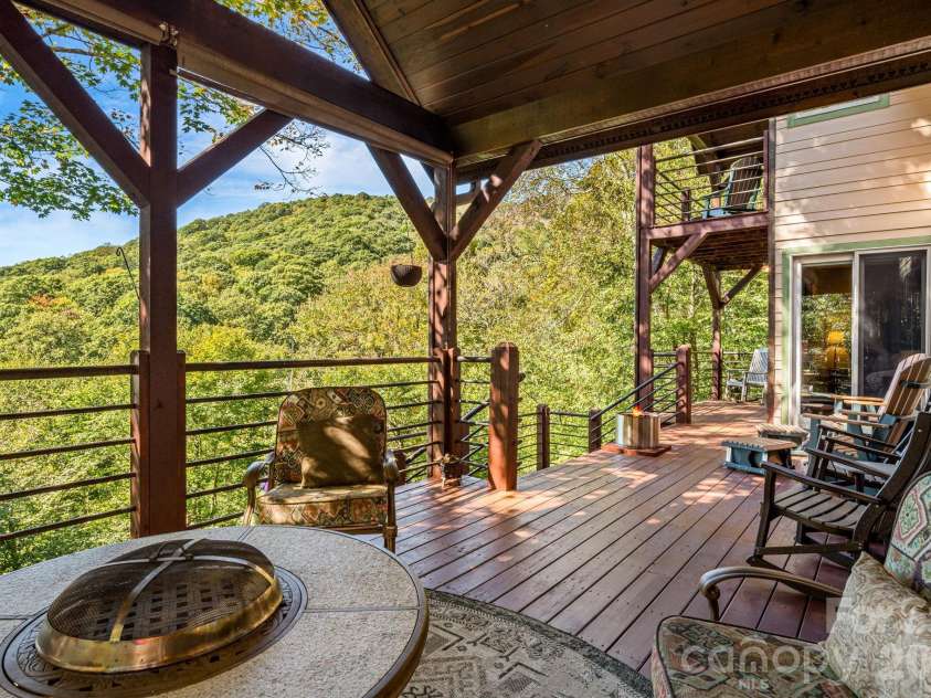 191 Ivy Way, Mars Hill, NC 28754.  MLS# CAR4308782, YatesRealty ID 1344. Covered deck off of the main level living room