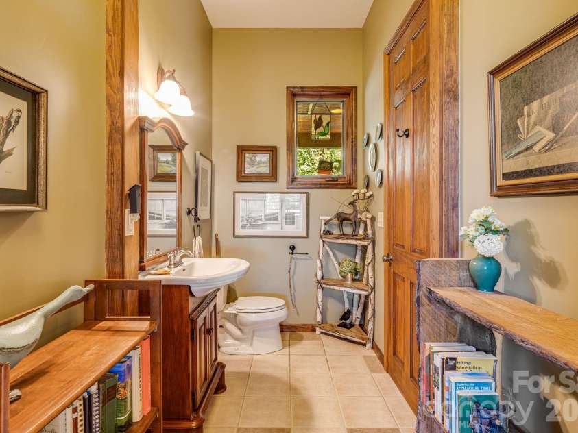 191 Ivy Way, Mars Hill, NC 28754.  MLS# CAR4308782, YatesRealty ID 1344. Half bath on the main level for guests.