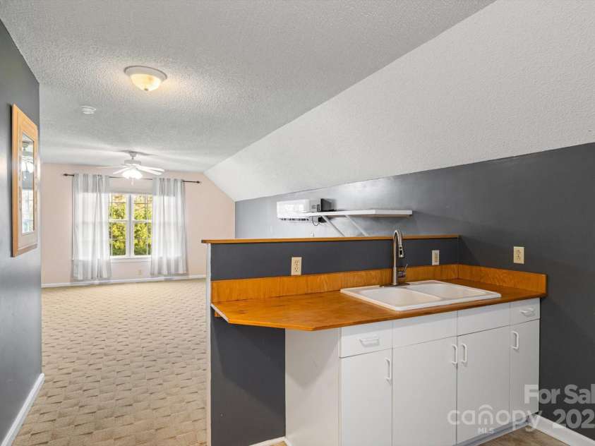 2409 Golf Course Road, Columbus, NC 28722.  MLS# CAR4318941, YatesRealty ID 13442. Finished room over garage with kitchenette, separate HVAC, and full bath.