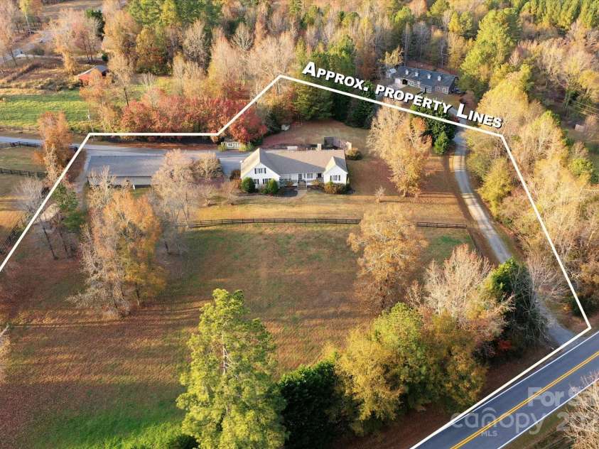 2409 Golf Course Road, Columbus, NC 28722.  MLS# CAR4318941, YatesRealty ID 13442. Full compound includes 2100+ SQ ft. main residences, 477 SQ ft living quarters over garage, detached three stall garage/workshop (with 700+ SQ ft. finished space).  2 outbuildings, 1 acre fenced pastures, walk-in shed