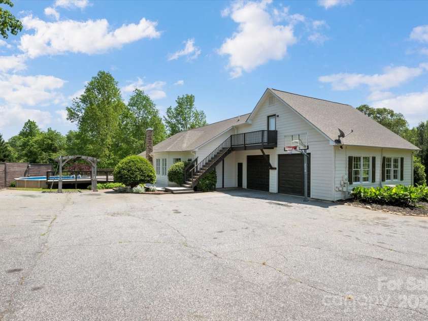 2409 Golf Course Road, Columbus, NC 28722.  MLS# CAR4318941, YatesRealty ID 13442. More parking than you can shake a stick at.