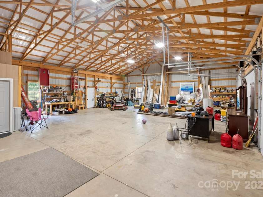 2409 Golf Course Road, Columbus, NC 28722.  MLS# CAR4318941, YatesRealty ID 13442. Three bays, including an oversized door.  Over 1800 SQ ft of workspace.  You could fit 39 Smart cars in here (I really did the math!).