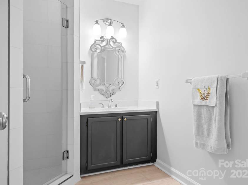 104 Pier 33 Drive, Mooresville, NC 28117.  MLS# CAR4255394, YatesRealty ID 13444. Bathroom two adjoins bedroom 2 and also opens to the hall.  It features a separate water closet and newly tiled shower.