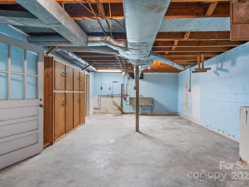 220 Broad Street, Marion, NC 28752.  MLS# CAR4257550, YatesRealty ID 13447. Laundry/Workshop