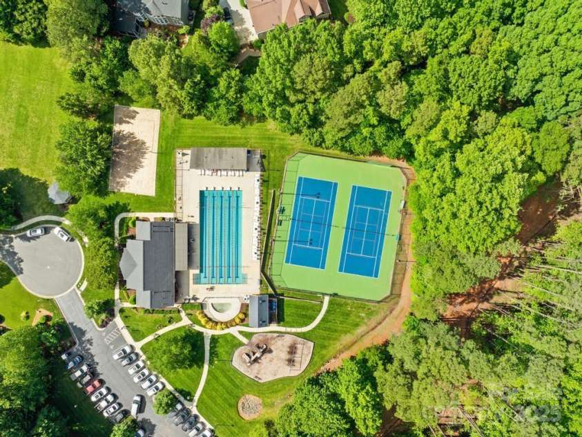9311 St Barts Lane, Huntersville, NC 28078.  MLS# CAR4255582, YatesRealty ID 13449. One of two sets of Clubhouses and Pools/Tennis & pickleball Courts and Playgrounds for the exclusives use of the 365 Hamptons residents only. This is the Vixen Pool & Clubhouse with ball field and sand volleyball cou